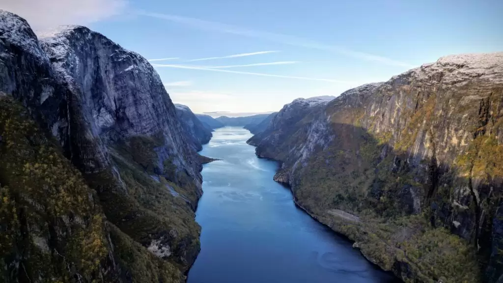 Snowy mountians by a lake in Alaska photographed by Craig Hale