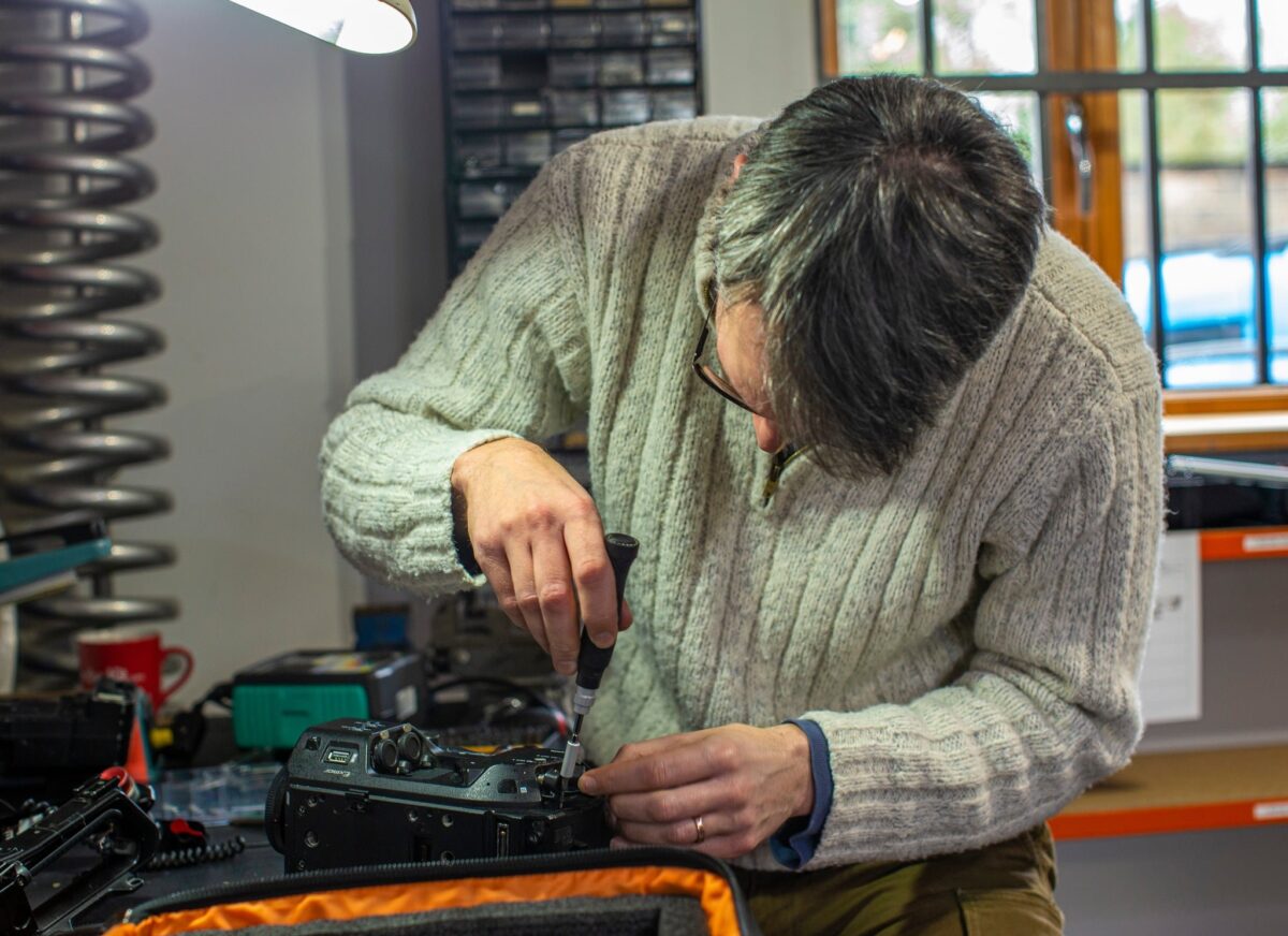 Andrew Davis working on equipment repairs
